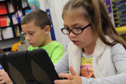 child on iPad