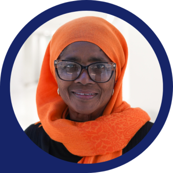 Dr. Patricia in a beautiful orange scarf