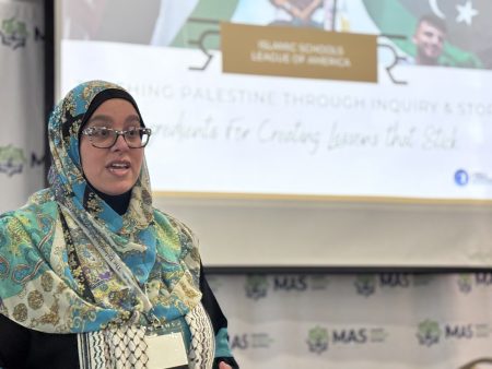 Rasha El-Haggan Presenting with screen behind her